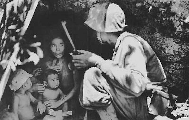 Marine Talks to Chamorro Locals, Saipan, Northern Marianas, June 1944