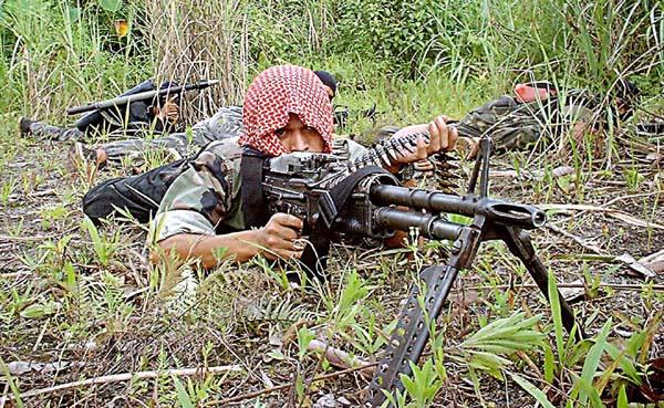 Moro Insurgent Trains with Machine Gun