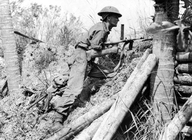 Australian Soldier Stands on Guard at Labuan Airstrip during WWII; Malaysia, June 1945
