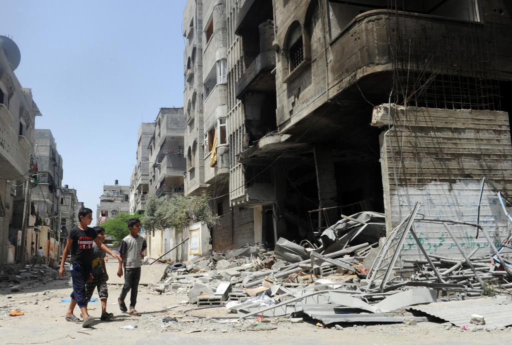 Gaza Residents Inspect Remains After Israeli Air Strikes, Gaza, July 2014
