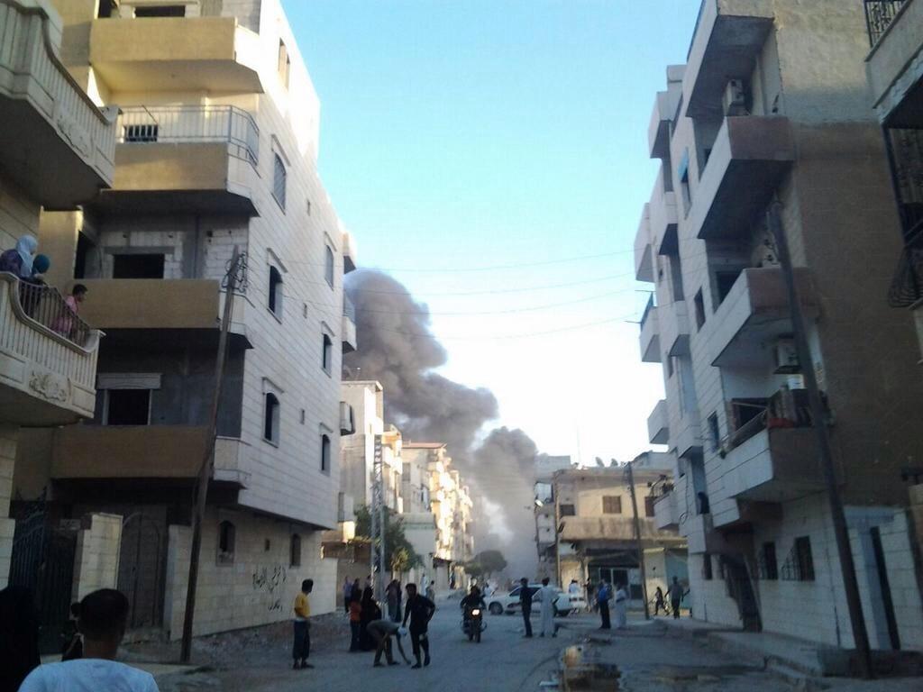 Syrian civilians on the street following government bombing, Al Raqqah Syria, August 2014