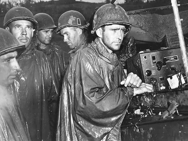 US GIs in Okinawa Listen Passively to News of Victory in Europe, Japan, May 1945