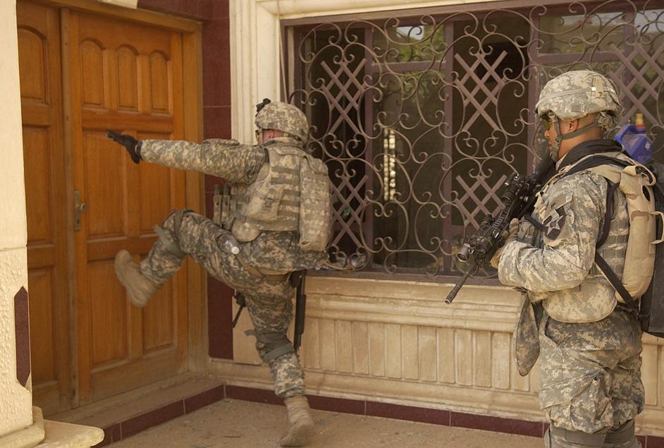 INFANTRY KICKS A DOOR IN, BAGHDAD