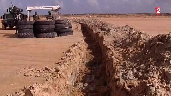 Tunisian Military Construct and Reinforce Trench and Barrier along the Libyan Border; July 2015