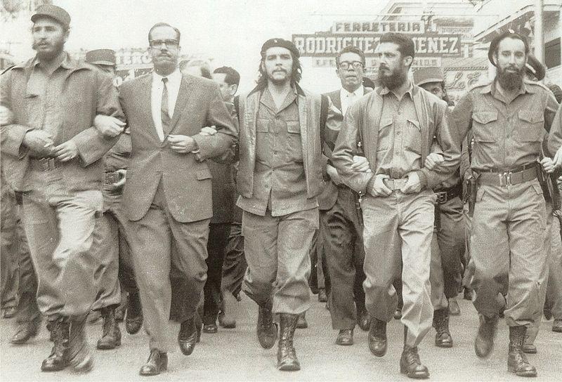 Fidel Castro and Che Guevara at memorial service march for victims of La Coubre explosion, Havana, C