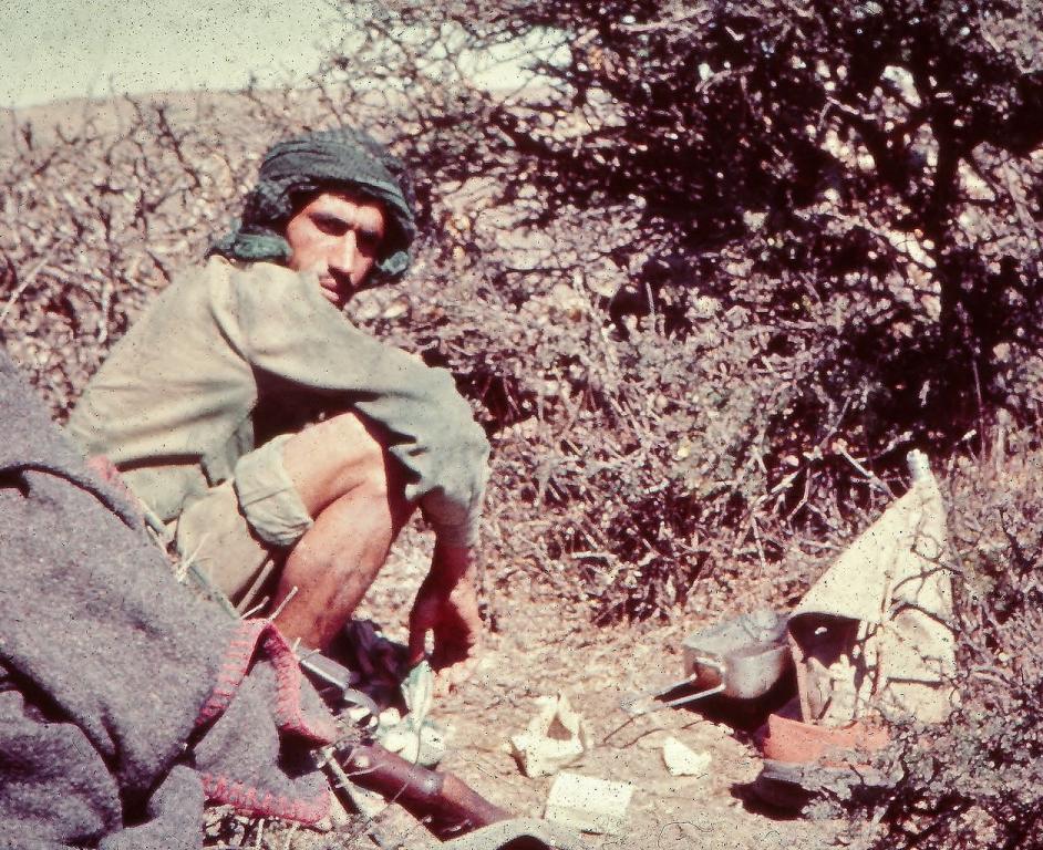 Omani Government Soldier Brewing Tea during Dhofar War; Oman, 1970