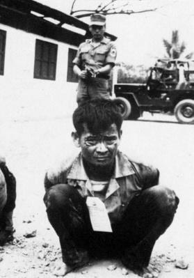Viet Cong Insurgent Awaits Interrogation, Tet Offensive, South Vietnam, 1968