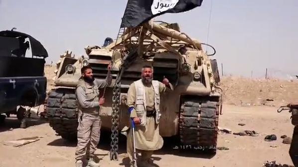 ISIS Fighters Pose in Front of Captured Iraqi Military Vehicle, Iraq, May 2015