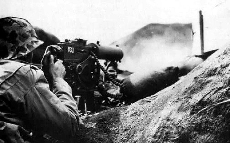 US Marine Fires Machine Gun, Iwo Jima, Japan, 1945