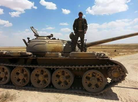 Kurdish (YPG) Infantryman Mounting Abandoned Syrian Government Tank; Hasakah, Syria, June 2015