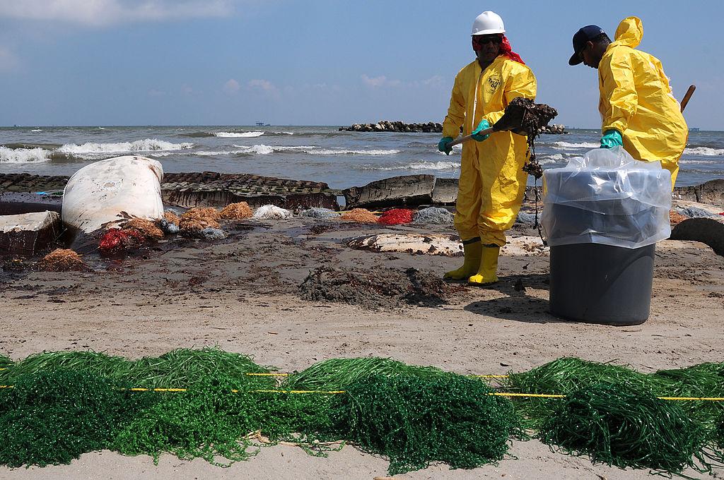 Workers Clean Up Beaches Following Deepwater Horizon