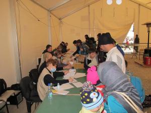 At Serbia's Presevo registration centre, personnel from the UN Refugee Agency take down personal det